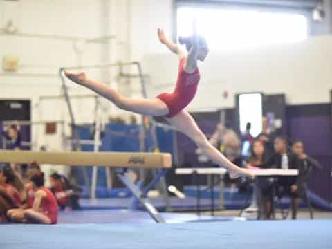 a woman doing gymnastics