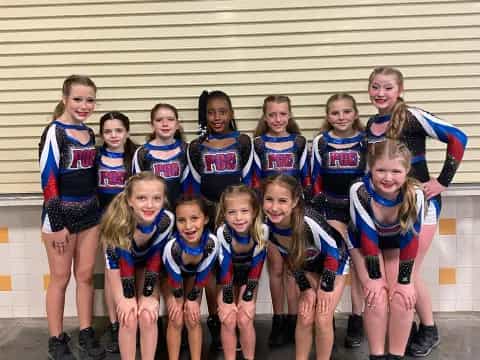 a group of girls in athletic wear