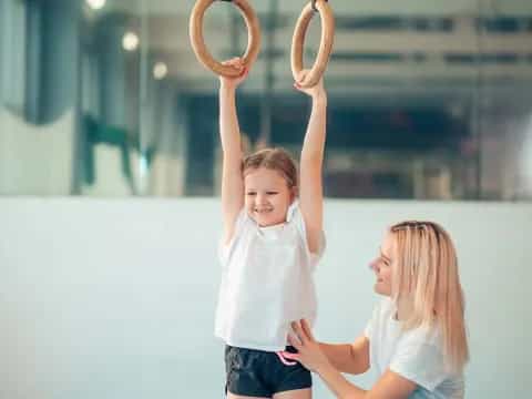 a boy and girl holding antlers
