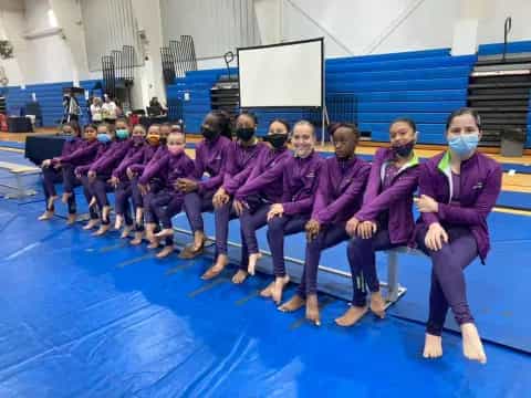 a group of people in purple robes