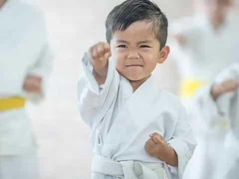 a young boy in a white shirt