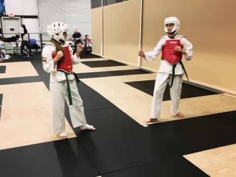 two people in white clothing