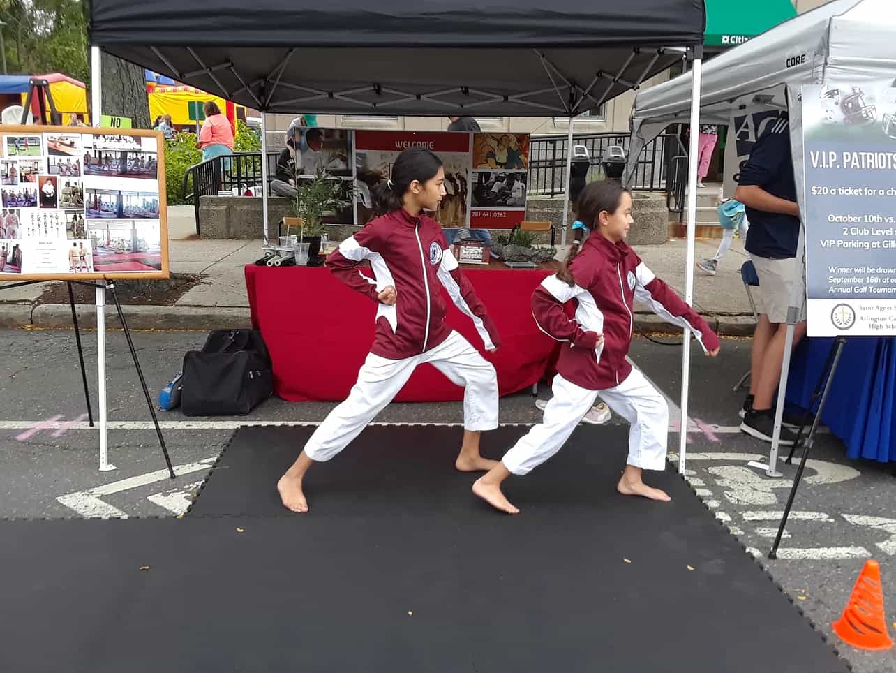 two women in red karate uniforms