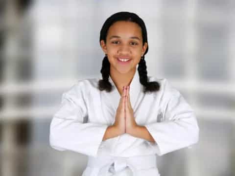 a woman with her hand on her chin