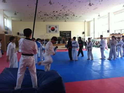 a group of people in karate uniforms