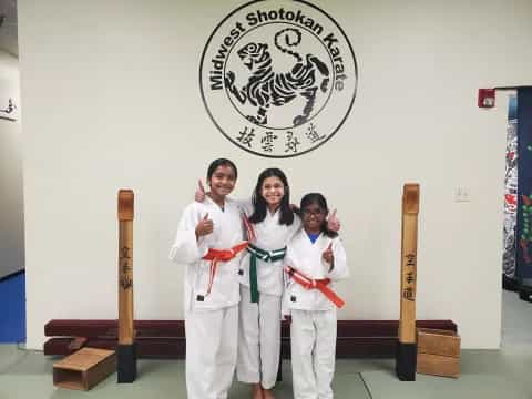 a group of people in karate uniforms