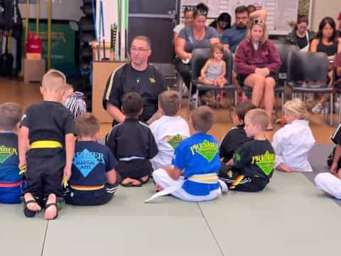 a group of people sitting on the floor