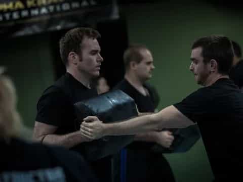 a person holding a black object