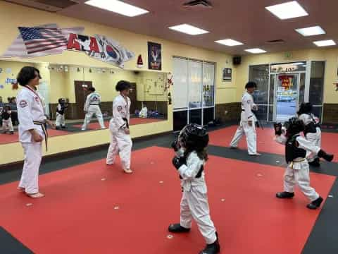 a group of people in karate uniforms