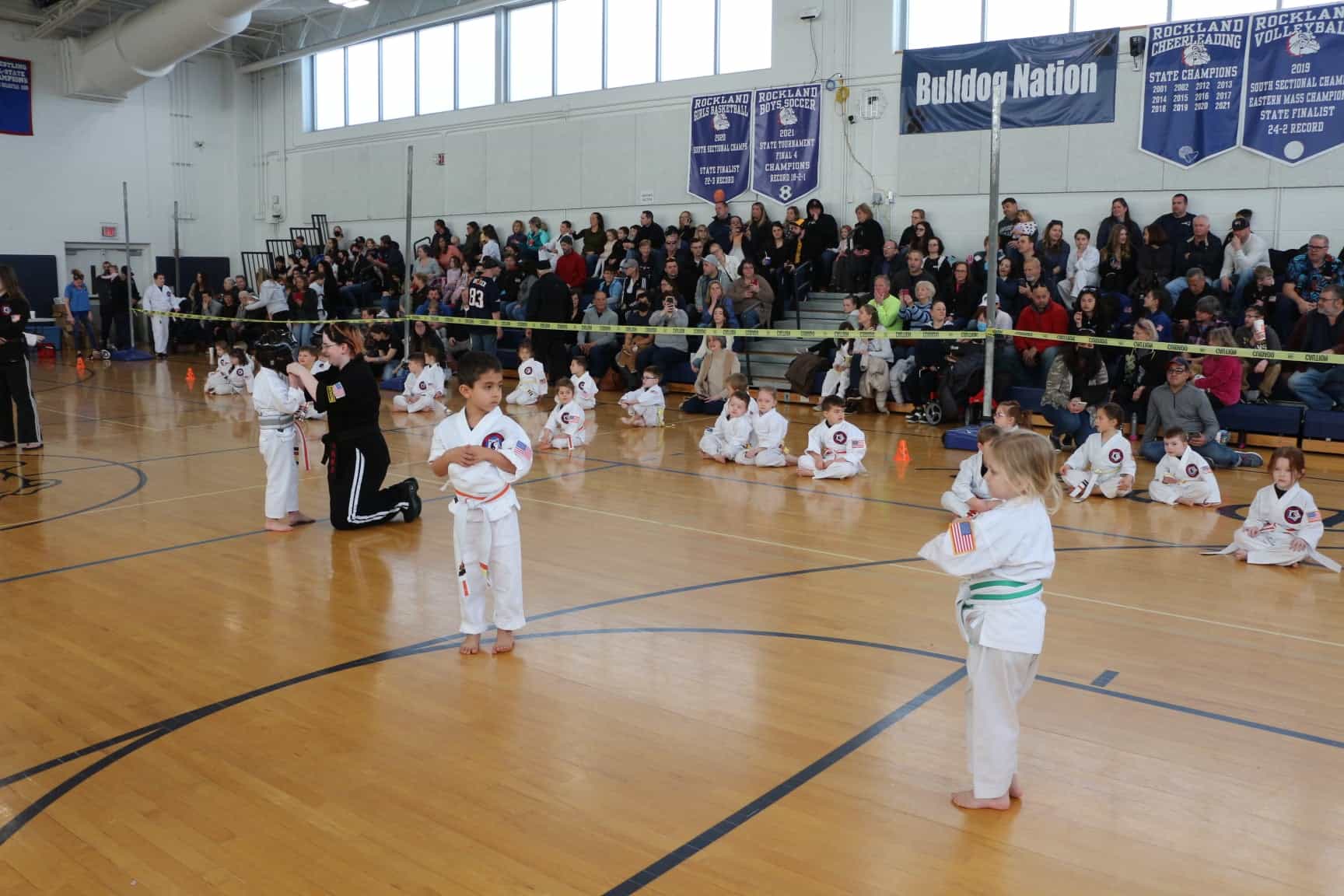 a group of children in karate uniforms