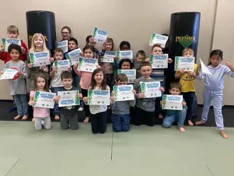 a group of children holding signs