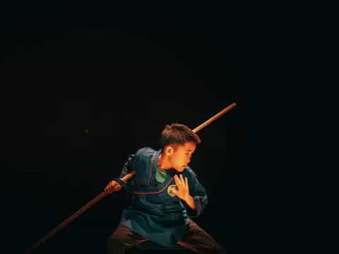 a boy holding a baseball bat