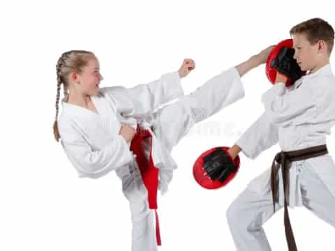 a man and a woman in karate uniforms