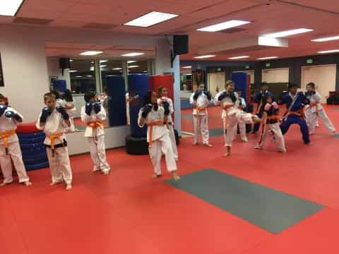 a group of people in karate uniforms