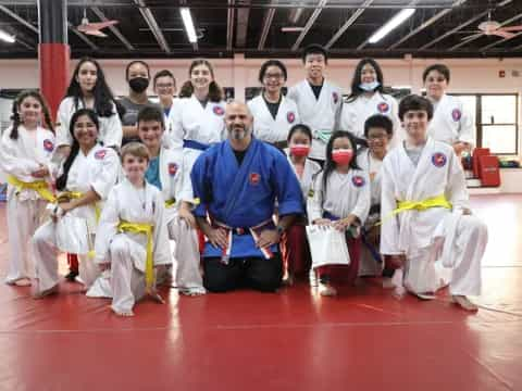 a group of people in karate uniforms