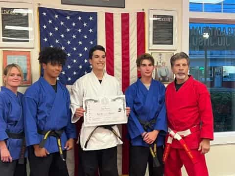 a group of people holding a sign