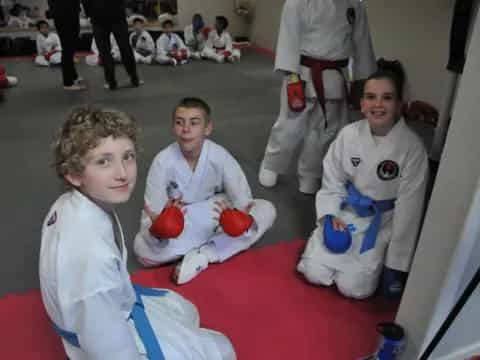 a group of people in karate uniforms