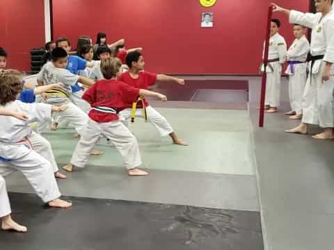 a group of people in karate uniforms