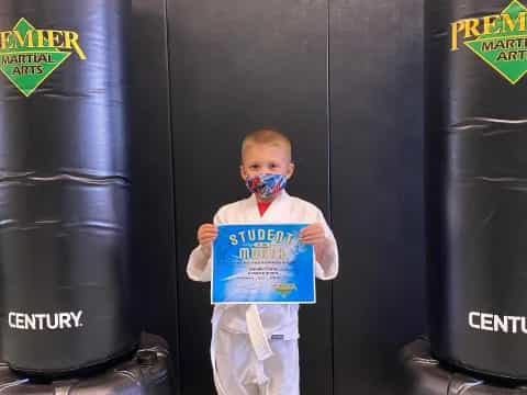 a boy holding a sign