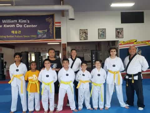 a group of people in karate uniforms