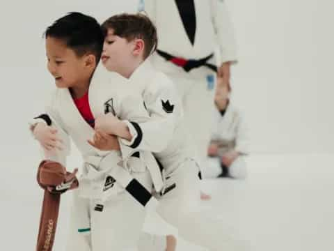 a group of boys in karate uniforms