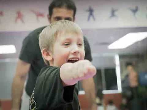 a boy eating a cookie
