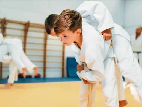 a group of people in karate uniforms