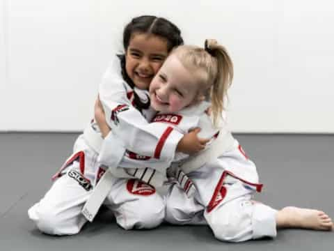 a man and a woman in karate uniforms