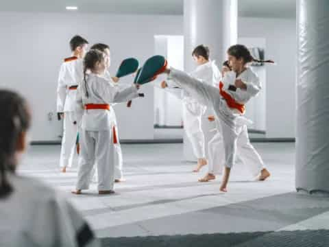 a group of people in karate uniforms