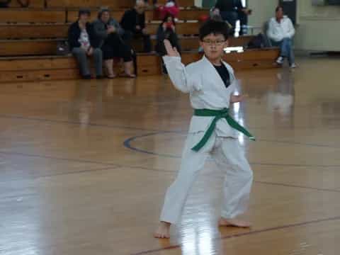 a boy in a karate uniform