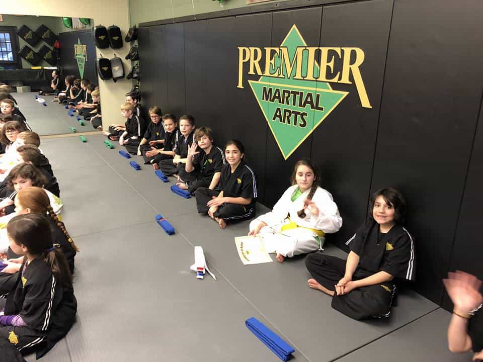 a group of people sitting on the floor