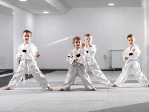 a group of people in karate uniforms