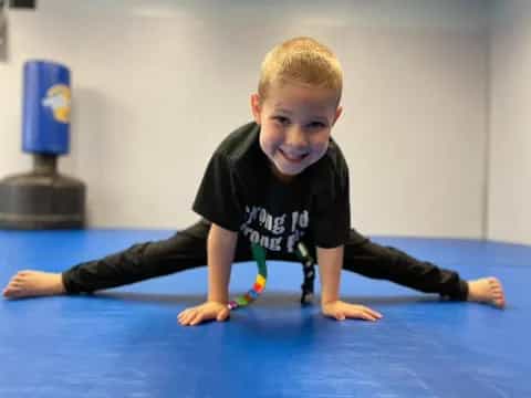 a boy sitting on the floor