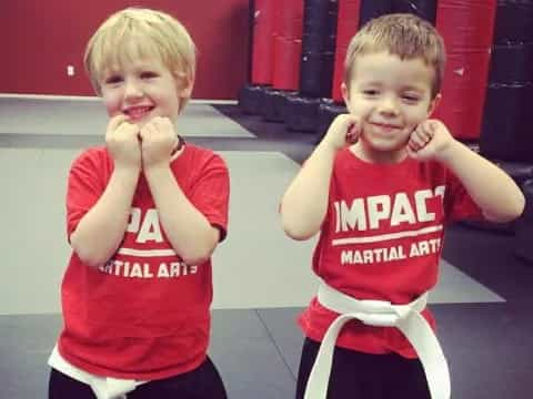 a couple of boys posing for the camera