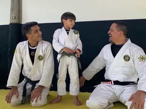 a group of men in karate uniforms