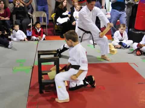 a boy in a karate uniform