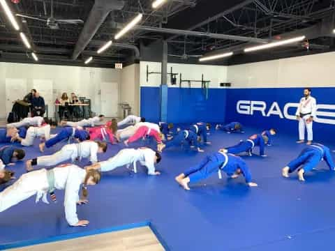 a group of people in a karate class