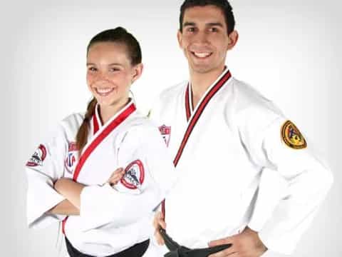 a man and a woman wearing medals