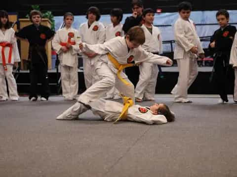 a group of people in karate uniforms