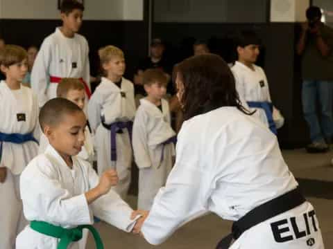 a group of people in karate uniforms