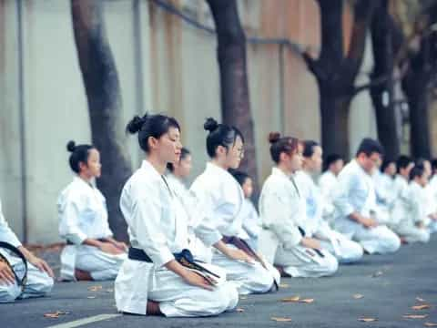 a group of people sitting on the ground