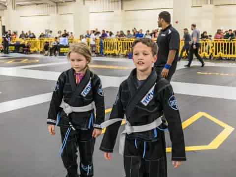 a couple of kids in a gym