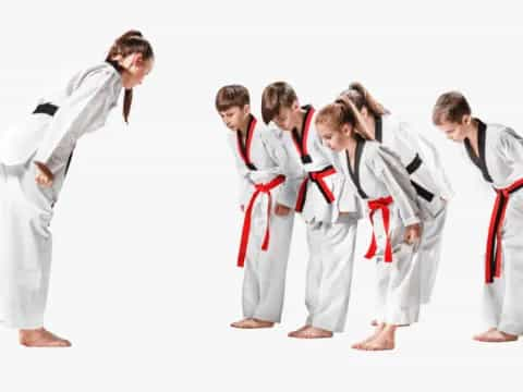 a group of people in karate uniforms