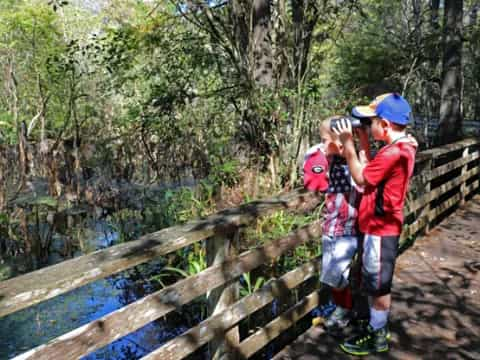 two boys on a bridge