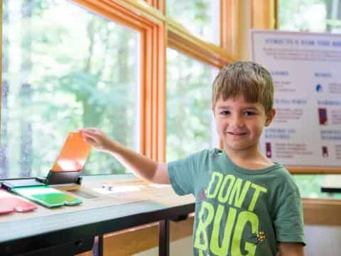 a boy sitting at a desk