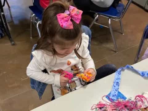 a girl playing with toys