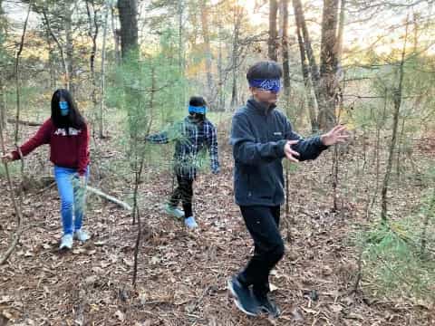 a group of people in the woods