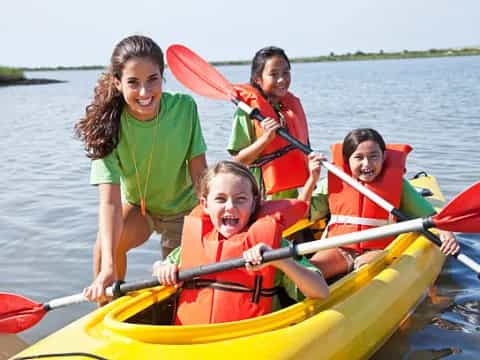 a group of people in a canoe