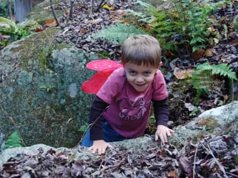 a child playing in the mud