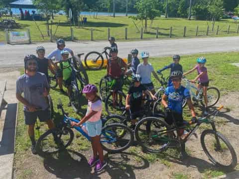 a group of people with bicycles